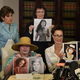 Attorney Gloria Allred (backgound, left) looks on as three more alleged sexual assault victims of comedian Bill Cosby, Colleen Hughes, Linda Ridgeway Whitedeer and Eden Tirl, hold up younger photos of themelves during a news conference in Los Angeles Aug. 12, 2015.
MARK RALSTON/AFP/Getty Images